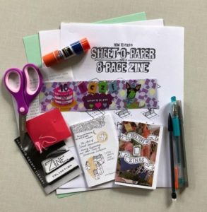 zine supplies including scissors, pens, a glue stick, and info about creating your own zine